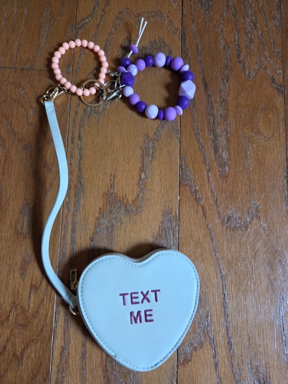 a new day Light Blue Heart Wristlet with "Text Me" & Wrist Carry Beads